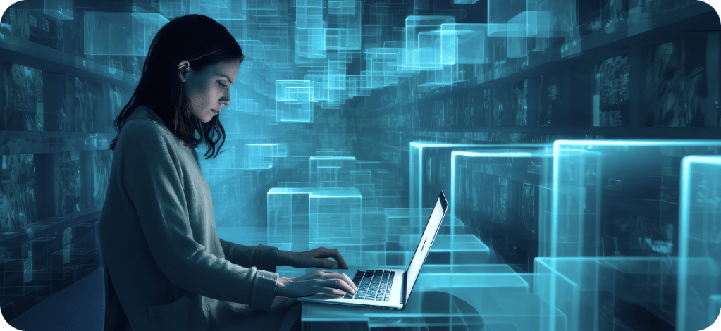 A woman seated on a chair, focused on her laptop, engaged in work or study.